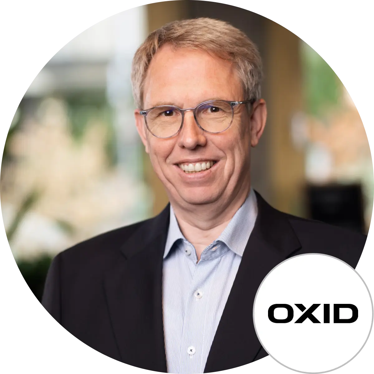 Porträt von Henry Goettler mit OXID Logo, OXID eSales AG
